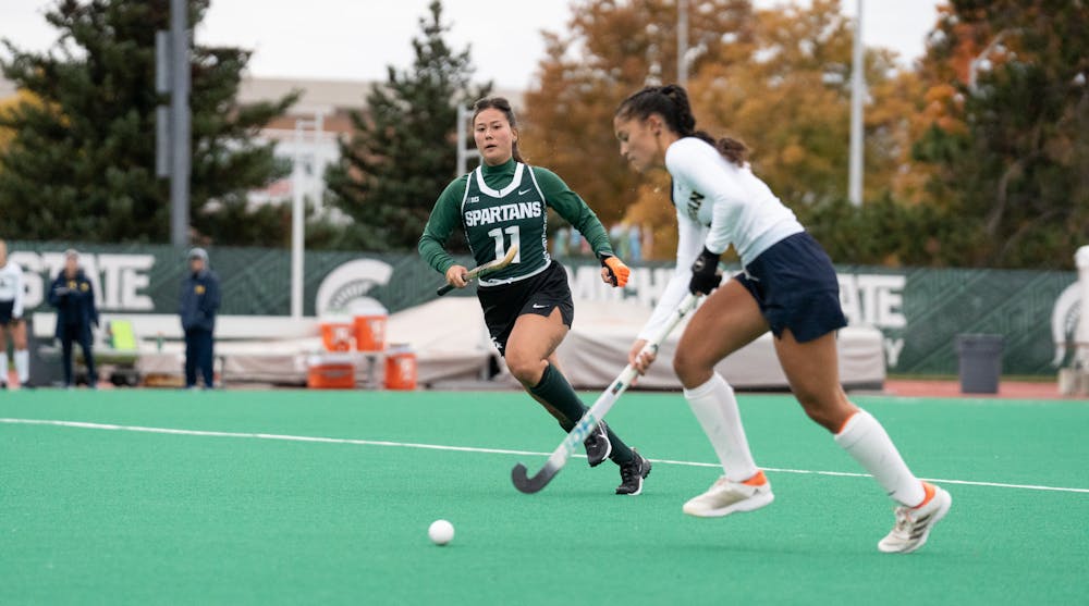 <p>Spartan forward Kim Smit rushes to get to the opponent during the match against the Wolverines on Oct. 7, 2022.﻿</p>