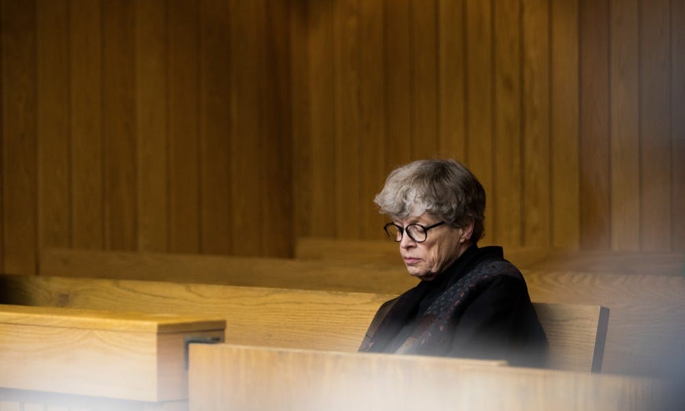 Former Michigan State President Lou Anna K. Simon waits for a preliminary hearing at Eaton County District Court to begin April 16, 2019. Simon is charged with four counts of lying to a peace officer, including two felonies.