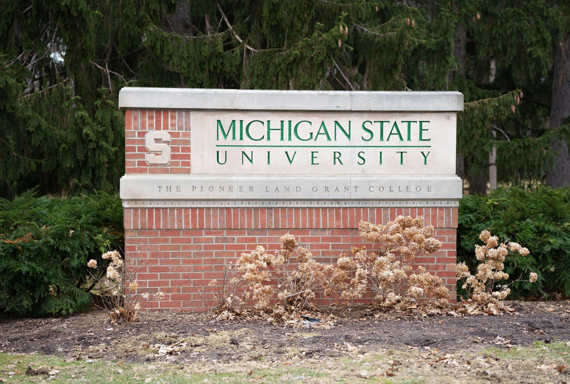 <p>One of the Michigan State University signs signifying where campus starts, located on the intersection of Grand River Ave and Bogue St, taken on Mar. 18, 2022.</p>