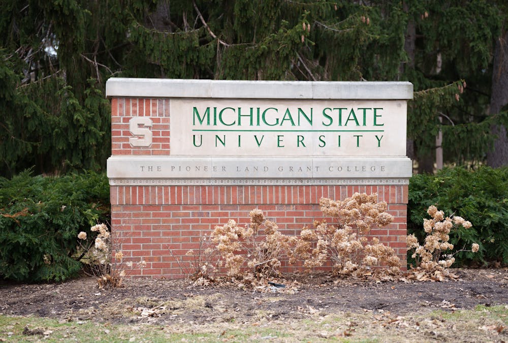 <p>One of the Michigan State University signs signifying where campus starts, located on the intersection of Grand River Ave and Bogue St, taken on Mar. 18, 2022.</p>