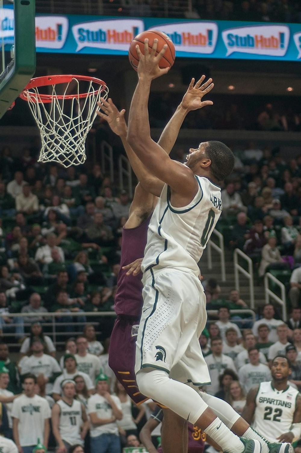 <p>Freshman forward Marvin Clark Jr. goes for the layup  Nov. 21, 2014, during the game against Loyal University at Breslin Center. The Spartans defeated the Ramblers, 87-52. Clark Jr. scored a total of 15 points. Raymond Williams/The State News</p>