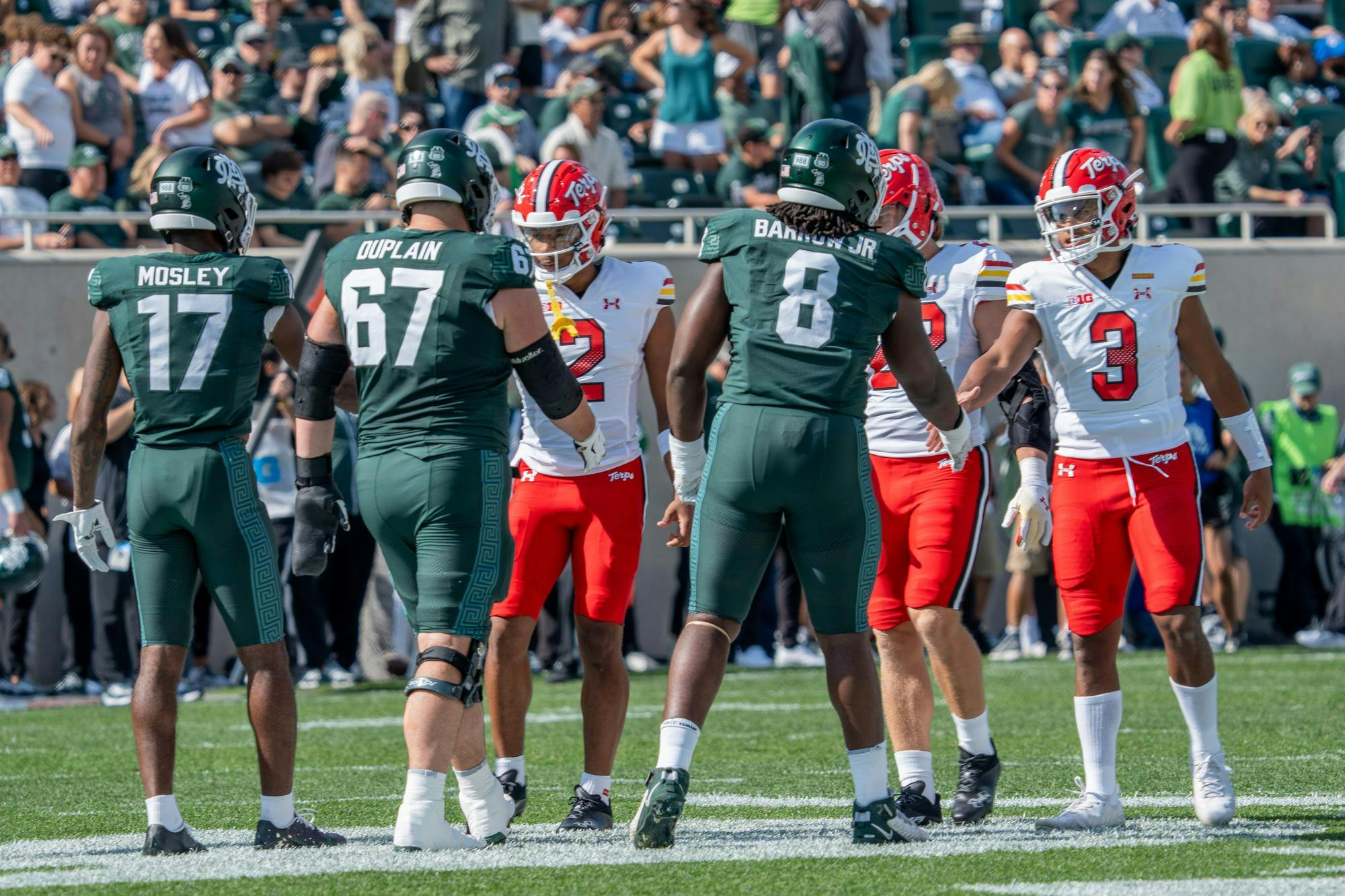 <p>Michigan State and Maryland players shake hands before the start of the game at Spartan Stadium on Sept. 23, 2023. The Spartans ultimately lost to the Terrapins 31-9.</p>