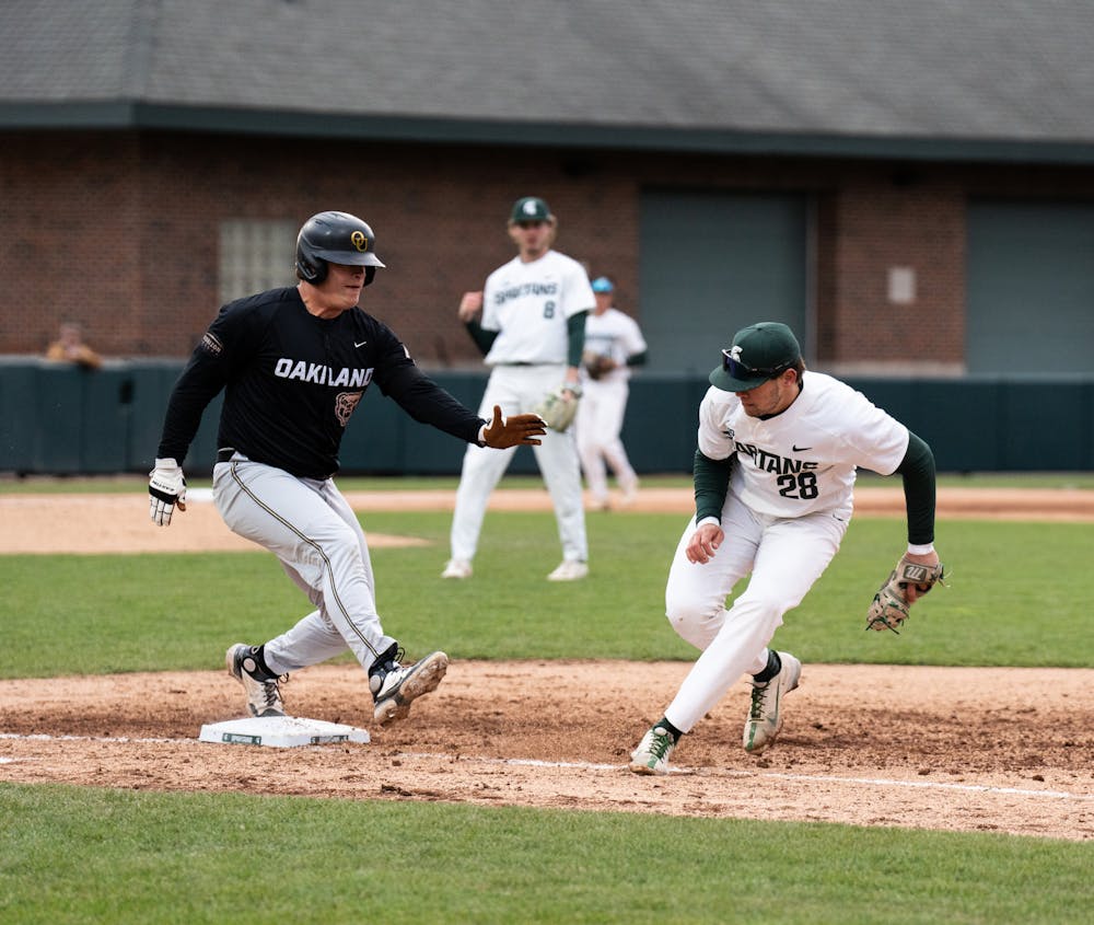 <p>MSU sophomore Brock Vradenburg attempts to get back to first base as Oakland hitter runs to first, April 19, 2022.</p>