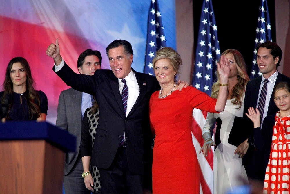 Republican presidential candidate Mitt Romney and Ann Romney wave to supporters at the Boston Convention Center in Boston, Massachusetts, after Romney loses the election to incumbent Barack Obama on Tuesday, November 6, 2012. (Carolyn Cole/Los Angeles Times/MCT)