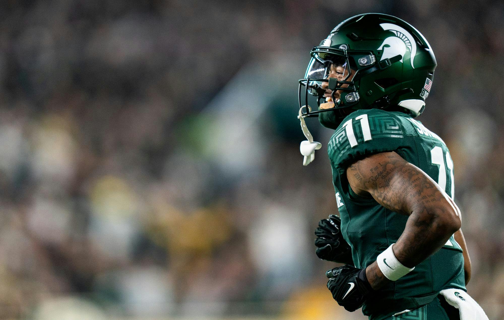 <p>Michigan State University redshirt freshman wide receiver Aziah Johnson (11) smiles after a successful play during the game against the University of Iowa on Oct. 19, 2024 in Spartan Stadium.</p>