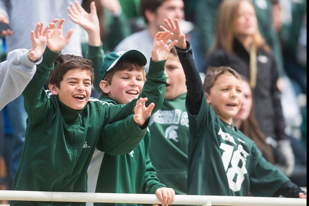 <p>Spartan fans call out to MSU's mascot, Sparty, during the Green and White Spring game April 25, 2015, at Spartan Stadium. The white team defeated the green team, 9-3. Hannah Levy/The State News</p>