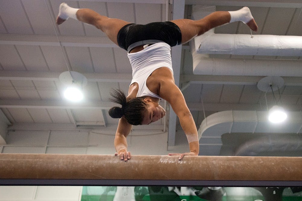 	<p>Junior gymnast Alina Cartwright practices on the balance beam Jan. 14, 2014, at Jenison Field House. Cartwright started gymnastics when she was three years old, just as a way to burn off some energy, but as she got older, she realized this was a sport she wanted to pursue. Julia Nagy/The State News</p>