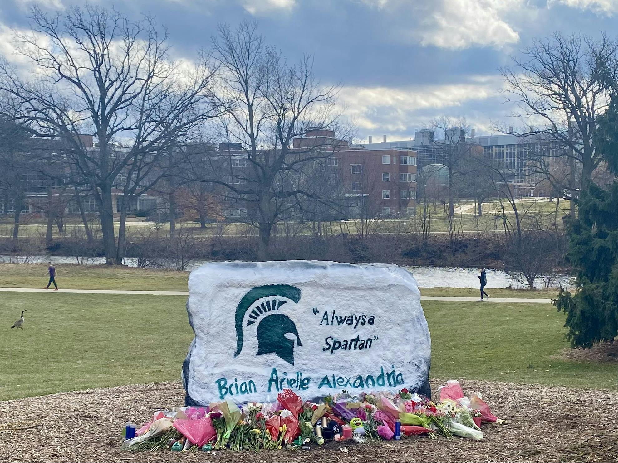 <p>Detroit based artist Anthony Lee painted The Rock on Farm Lane with "Always a Spartan" and the names of the students who lost their lives during the on-campus mass shooting on Feb. 13, 2023, at the request of the university.</p>
