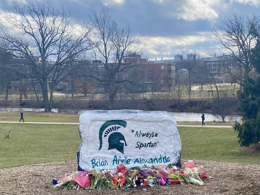 <p>Detroit based artist Anthony Lee painted The Rock on Farm Lane with "Always a Spartan" and the names of the students who lost their lives during the on-campus mass shooting on Feb. 13, 2023, at the request of the university.</p>