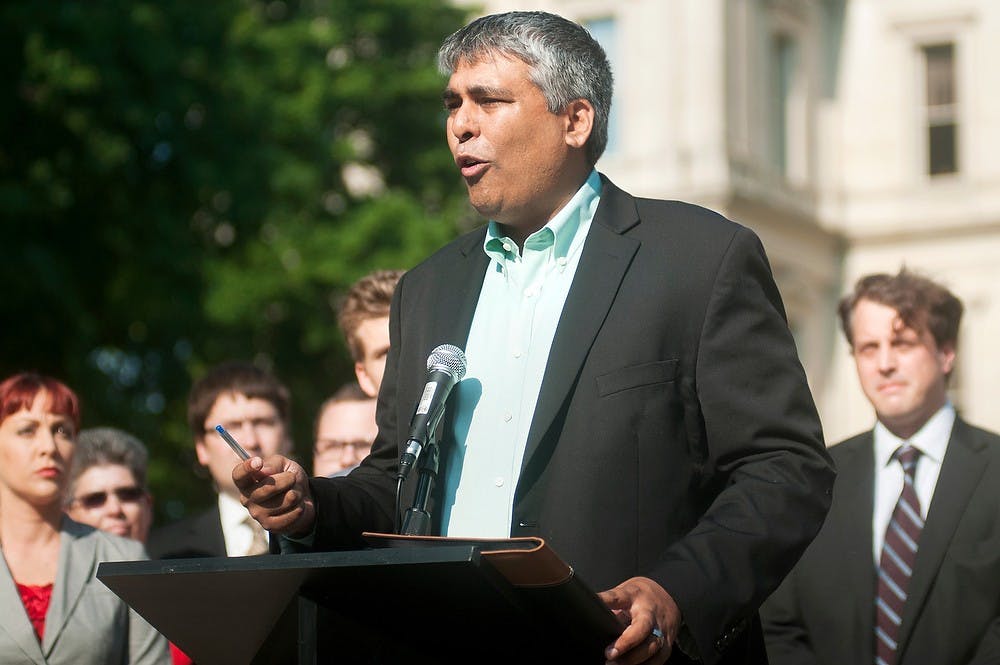 	<p>Michigan State Representative Sam Singh, D-East Lansing, speaks out to sponsor bills legalizing marriage equality in Michigan on June 24, 2013, in front of the state Capitol building in Lansing. The legislation package would allow marriage equality, recognize marriages from other states, amend marriage laws, and repeal the Defense Of Marriage Act. Danyelle Morrow/The State News</p>
