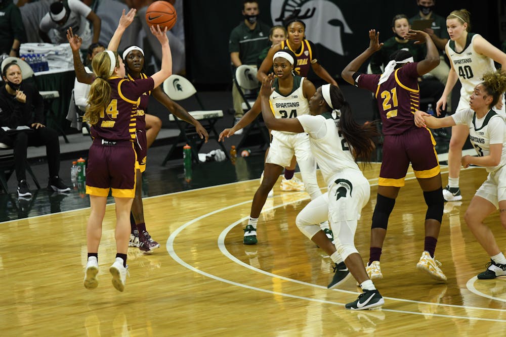 <p>Central Michigan guard Molly Davis rises up for a three-point shot against Michigan State on Dec. 18, 2020, at the Breslin Center.</p>