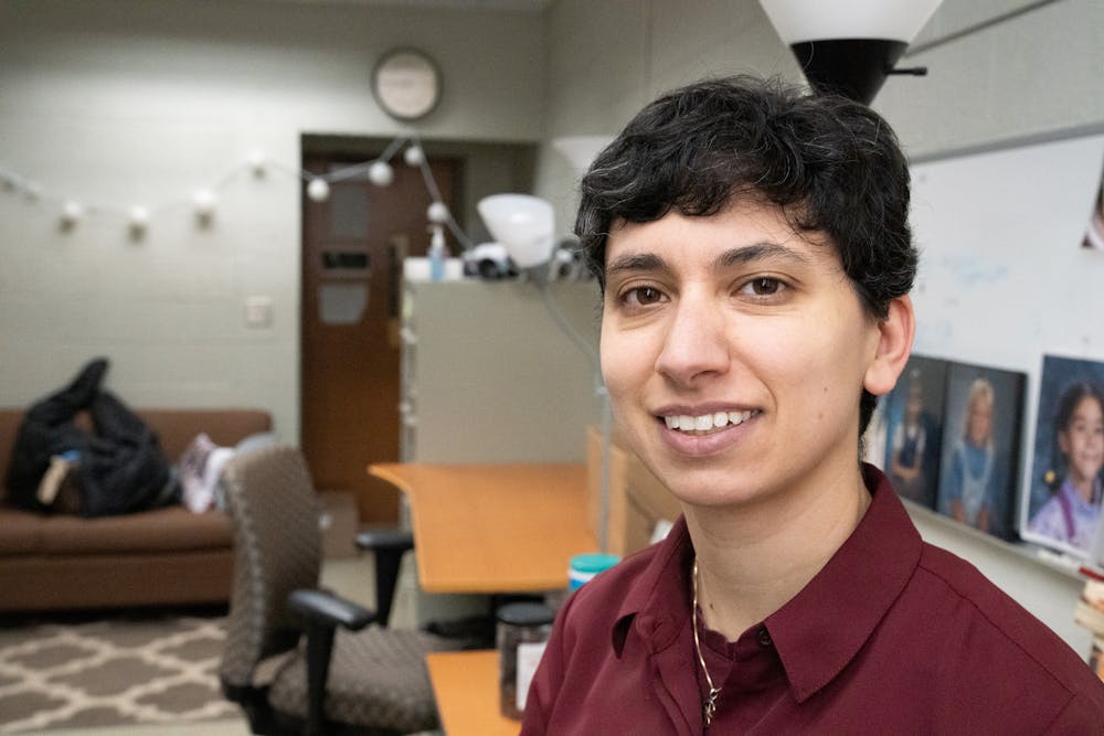 Graduate student Megan Mikhail poses for a portrait in their office on Tuesday, Feb. 28, 2023. Mikhail is a clinical psychology PhD candidate and the lead author on the first research paper to investigate the links between disadvantage and disordered eating in boys.