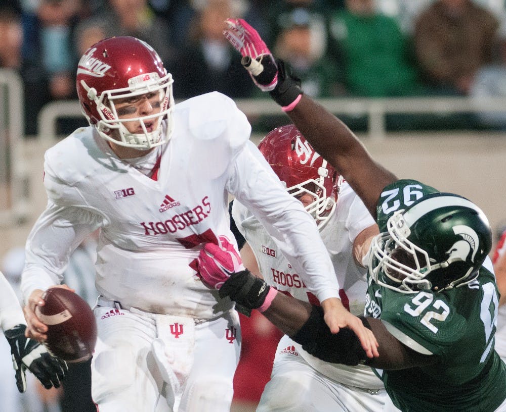<p>Senior defensive lineman Joel Heath sacks Indiana quarterback Nate Sudfeld for a loss of eight yards during the game against Indiana on Oct. 24, 2015, at Spartan Stadium. The Spartans defeated the Hoosiers, 52-26.</p>