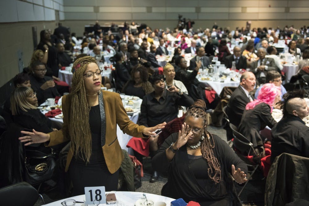 Jaysha Murphy, left, and Lydia McElrath, both of Lansing, dance while the Dream Orchestra performs during the 34th Annual Dr. Martin Luther King Jr. Luncheon Celebration at the Lansing Center in Lansing on Jan. 21, 2019. Nic Antaya/The State News