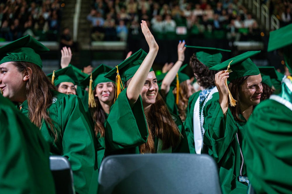 <p>Michigan State students wave to their parents during a convocation in East Lansing, Mich., on May 1, 2026.</p>