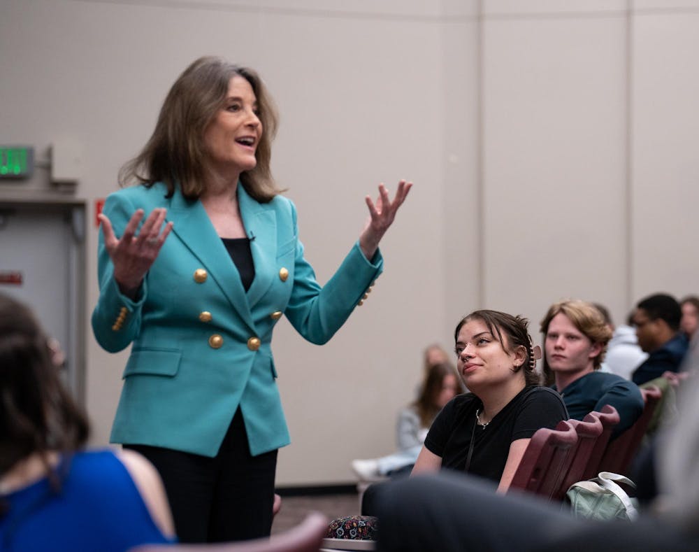 <p>A supporter listens intently as Marianne Williamson, a Democratic candidate for the 2024 presidential election, spoke about her agenda at MSU's Broad College of Business on April 24, 2023.</p>