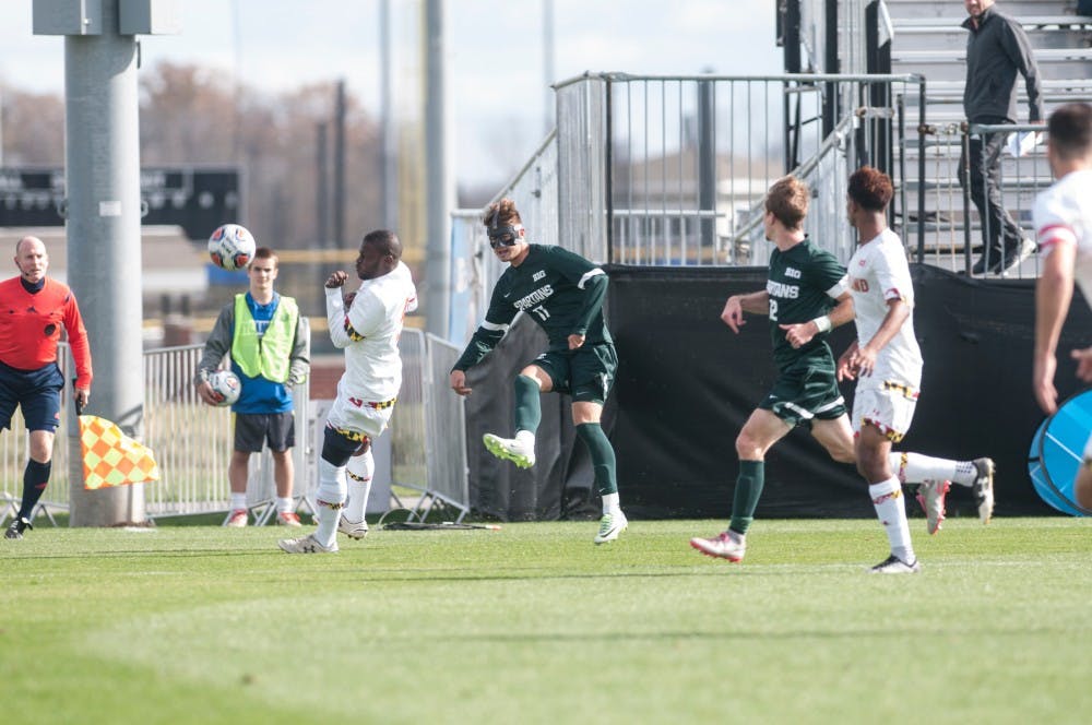 Sophomore forward Ryan Sierakowski (11) sends in a cross during the Big Ten men's soccer semifinal against Maryland on Nov. 11, 2016 at Grand Park in Westfield, Ind. The Spartans were defeated by the Terrapins, 2-1. 