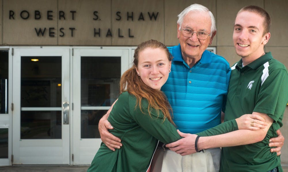 <p>From left to right, accounting senior Kristen Patterson, her grandfather Okemos resident Jerry Hull and her cousin accounting sophomore Ethan Wingrove pose for a portrait on Sept. 18, 2015 in front of West Shaw Hall. All three lived in Shaw Hall. Patterson lived there from Fall 2013-Spring 2014. Wingrove lives there currently. Hull lived in the dorm from 1950-1951.</p>