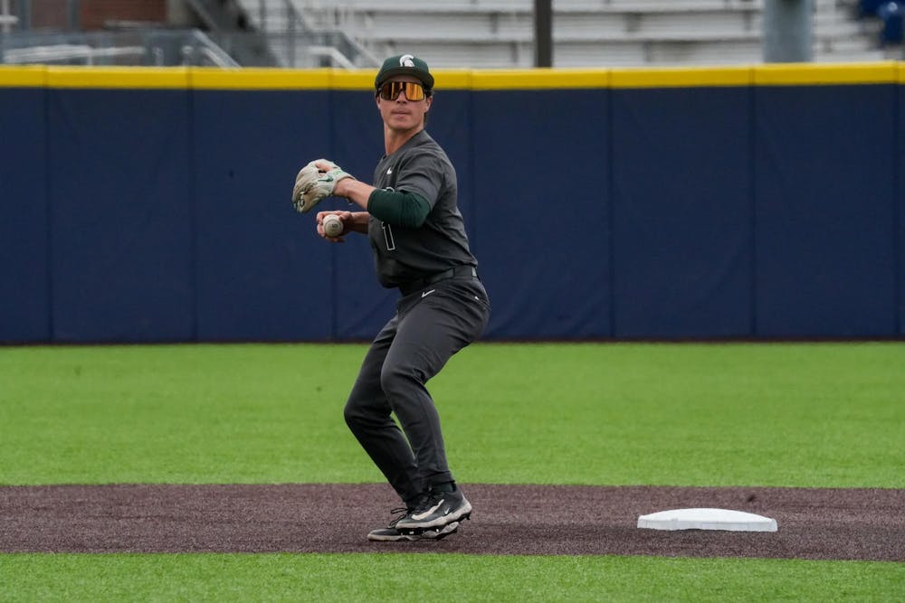Michigan State sophomore second baseman Ryan McKay (1) throws the ball to first base on April 26, 2025. The Spartans lost to the Wolverines in the second game 9-2.