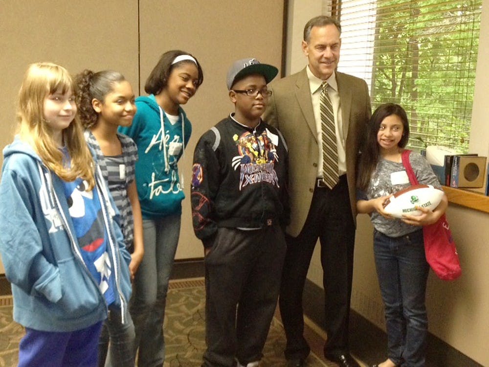 	<p><span class="caps">MSU</span> football head coach Mark Dantonio visits with members of Big Brothers Big Sisters during an event in August 2012. Photo Courtesy of Big Brother Big Sister</p>