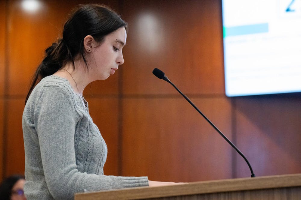 Michigan State University sophomore and journalism student, Anna Wildman speaks to the board for public comment during the MSU Board of Trustees at Hannah Administration Building in East Lansing, Michigan on Friday, Dec. 12, 2025. 