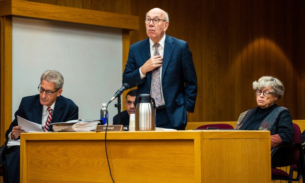 Defense attorney Terry Dillon (center) objects to a line of questioning during the seventh day of former MSU President Lou Anna K. Simon's (right) preliminary examination at the Eaton County Courthouse on July 23, 2019. 