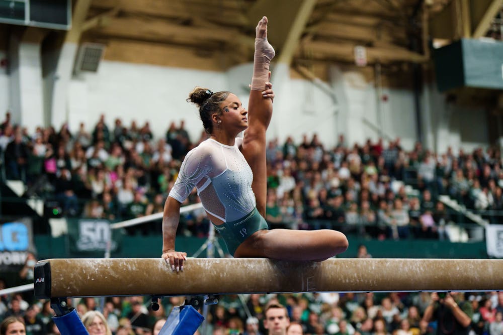 <p>Sophomore Skyla Schulte competes on the balance beam during a meet against the University of Michigan, held at Jenison Field House on Jan. 22, 2023. The Spartans upset the No. 3 ranked Wolverines with 197.200 points.</p>
