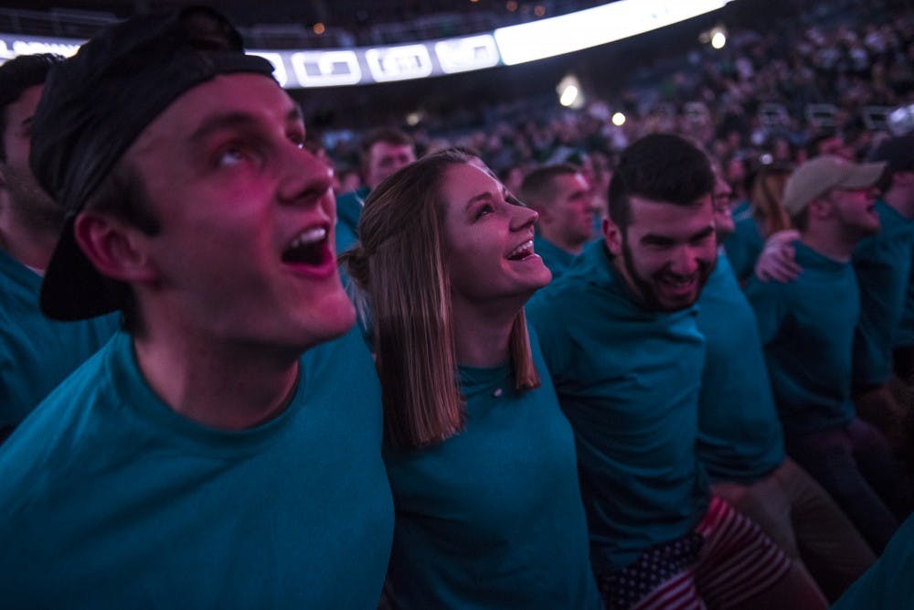 Students in the Izzone cheer before the men's basketball game against Wisconsin on Jan. 26, 2018 at Breslin Center. (Nic Antaya | The State News)