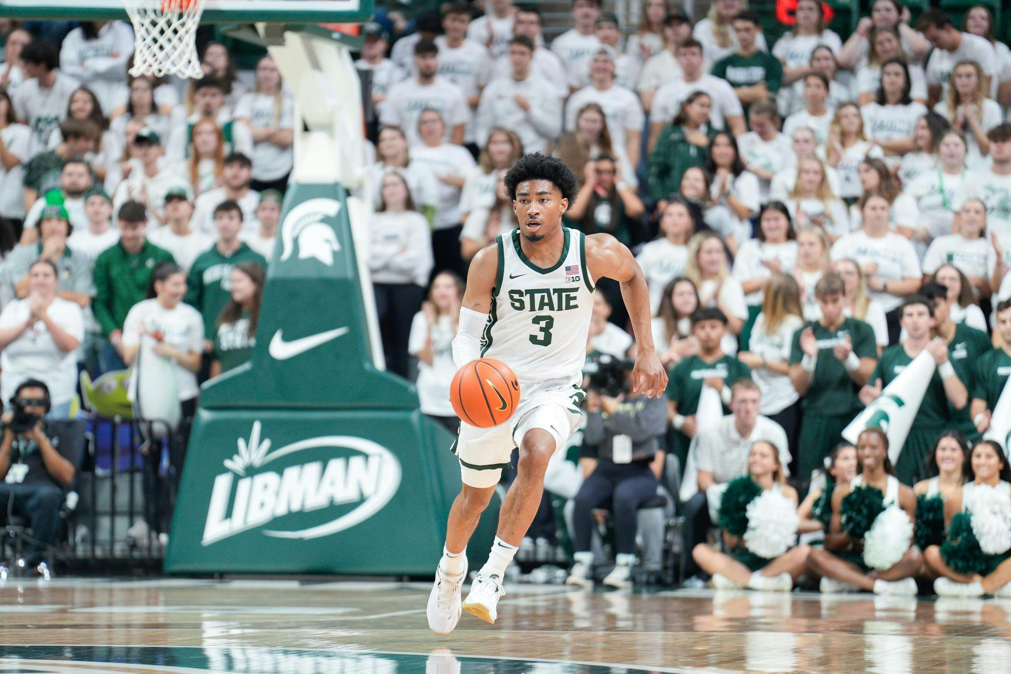 Junior guard Jaden Akins (3) dribbles the ball during a game against Hillsdale at the Breslin Center on Oct. 25, 2023. The Spartans defeated the Chargers 85-43. 