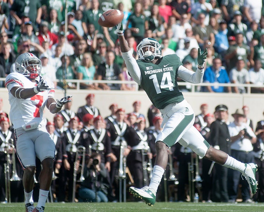 	<p>Sophomore wide receiver Tony Lippett tries to grab a pass in the end zone without success. The Buckeyes defeated the Spartans, 17-16, on Sept. 29 at Spartan Stadium. </p>
