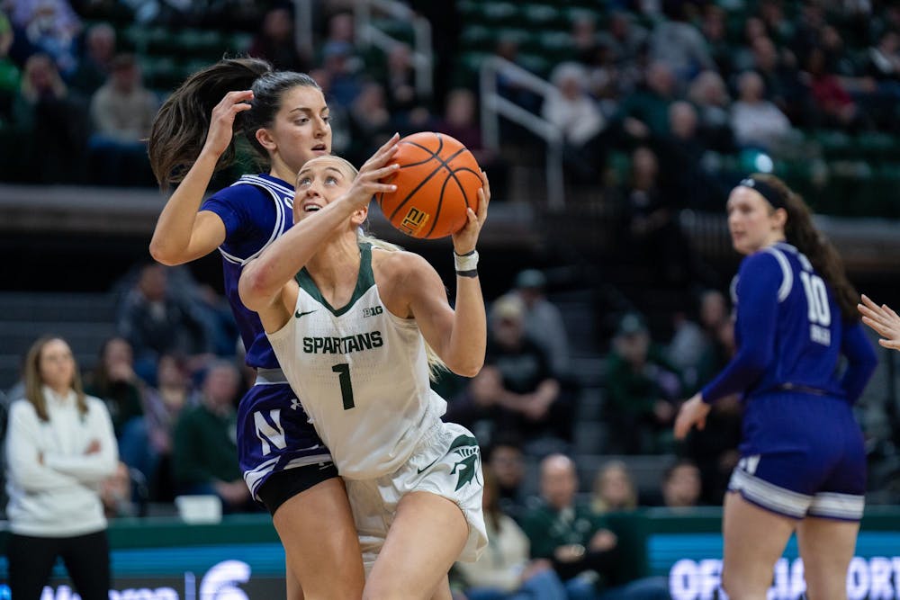 Michigan State University graduate guard/forward Tory Ozment (1) runs to take a shot during a game against Northwestern at the Breslin Center on Jan. 17, 2024.  The Spartans took home a win against the Wildcats with a score of 91-72.
