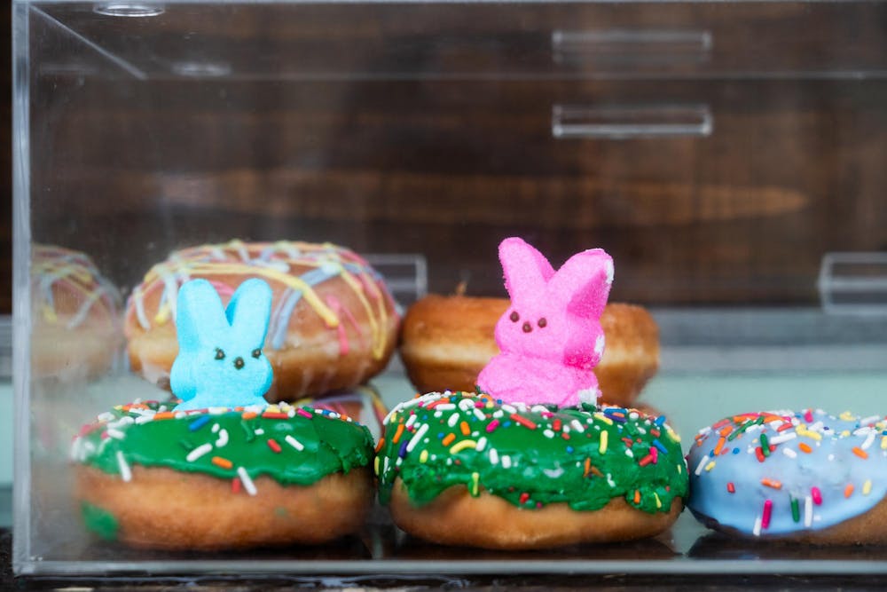 <p>A pair of donuts topped with peeps sold by a Tin Cup Cafe truck at an Easter egg hunt on the Capitol lawn in Lansing, MI, on Saturday, March 30, 2024. The truck sold donuts and hot drinks during the rainy Saturday morning event.</p>
