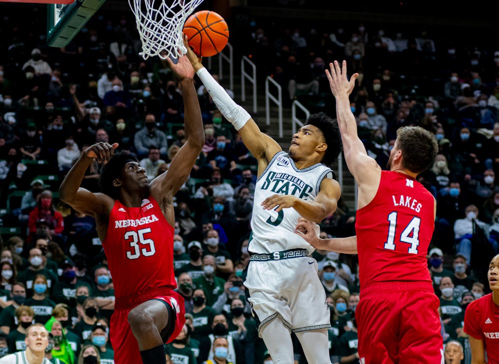 Freshman guard Jaden Akins finishes a contested layup during the Spartans' 79-67 win over Nebraska on Jan. 5, 2022.