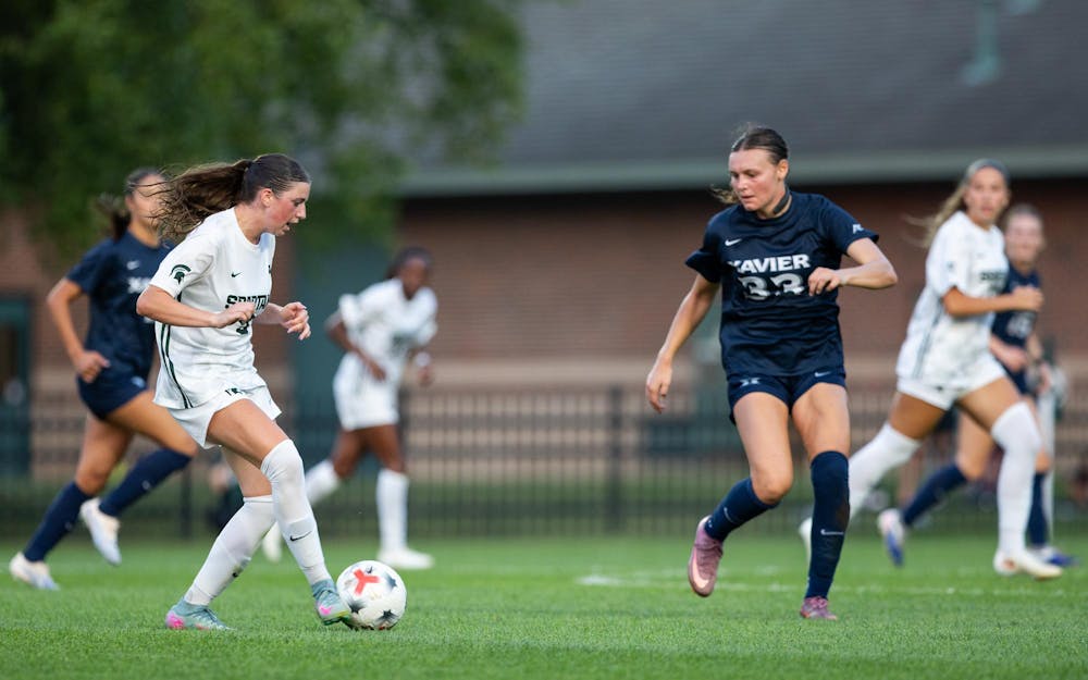 <p>Michigan State Sr. M, Kayla Briggs (9), passes the ball ahead to her teammate in DeMartin Stadium in East Lansing, Mich., on Aug. 12, 2026.</p>