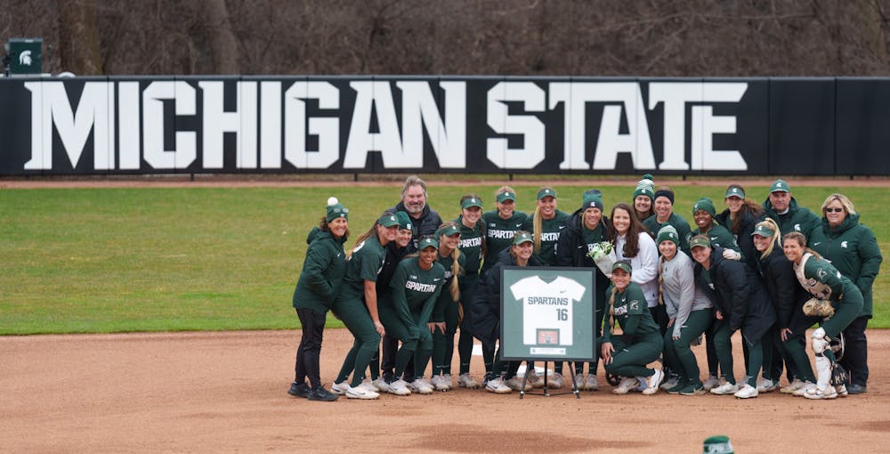 <p>The whole softball team gathers around Michigan State senior Leah Shipp and her jersey to honor her before the game against Nebraska starts. Spartans lost 6-0 against Nebraska, on April 9, 2022.</p>