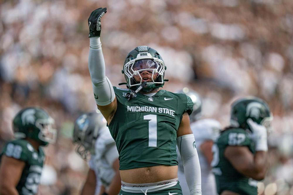 <p>Kenny Soares Jr. (1) celebrates after taking down Eastern Michigan running back Amareon Blue (15) to turn the ball over on downs early in the first quarter of the game in Spartan Stadium in East Lansing, Mich., on Sept. 12, 2026.</p>