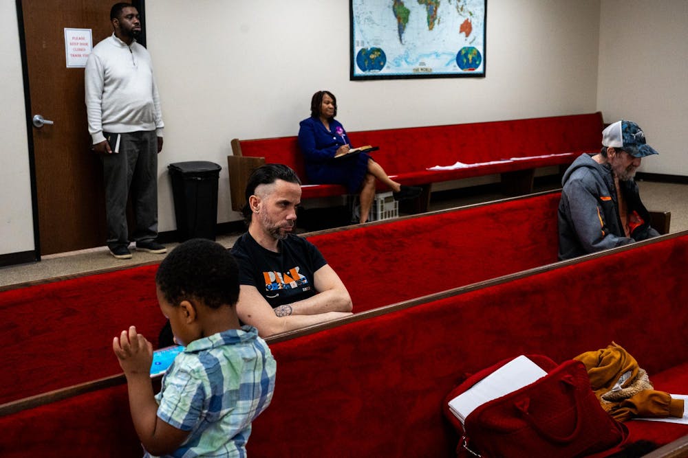 Congregants listen to Pastor Michael Venyah during a Sunday worship service at Soulwinners Fellowship Church in Lansing, Mich., on Sunday, April 12, 2026.