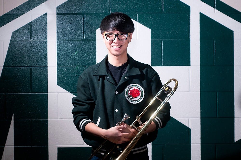 	<p>Supply chain management junior Luyi Han poses with his trombone on Thursday, at Demonstration Hall. Han went to the Rose Bowl earlier this year and was the first international student in the marching band since John Madden was hired as director. Betsy Agosta/The State News</p>