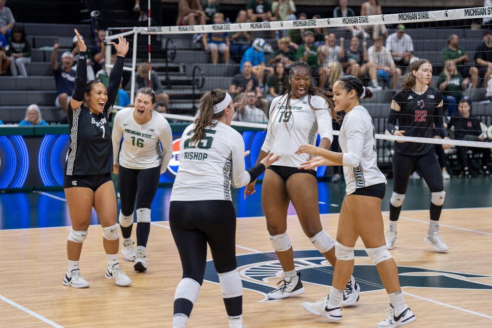 <p>Michigan State Volleyball players Sr. Nalani Iosia (1), So. Grace Kelly (16), Jr. Julia Bishop (25), Amani Mcarthur (19) and Fr. Makyla Clayton (5) celebrate during their game against Rutgers on Oct. 1, 2023 in East Lansing. Michigan State would go on to win in four sets in the Jack Breslin Student Events Center.</p>