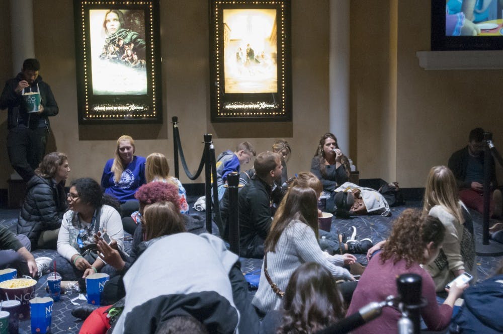 Movie goers wait in line to see Fantastic Beasts and Where to Find Them on Nov. 17, 2016 at NCG - Eastwood Cinemas in Lansing. Some movie goers waited in line for over an hour.