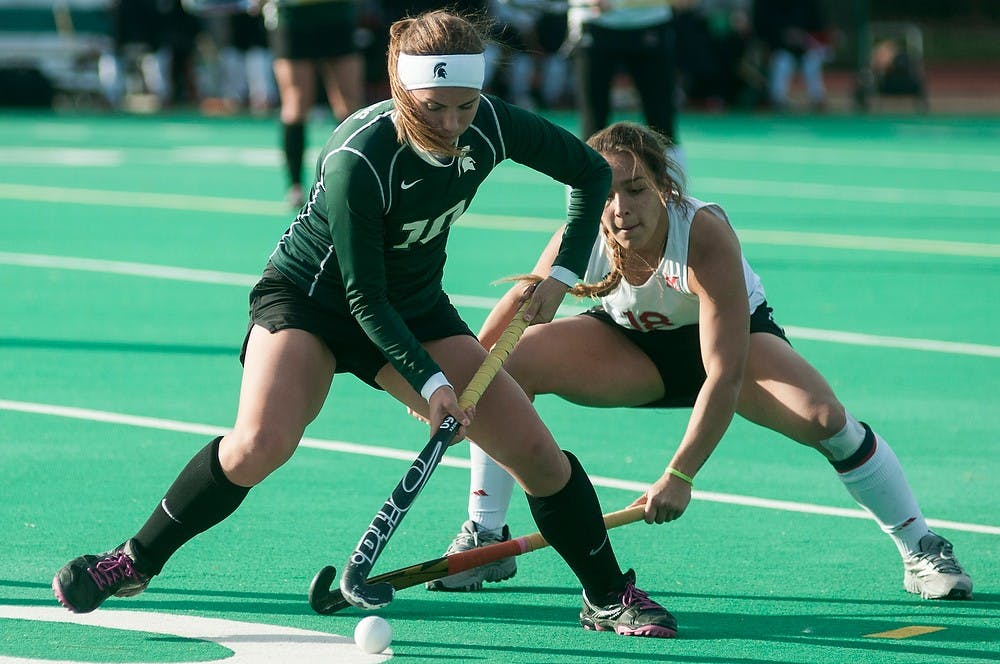	<p>Junior midfield/back Becky Stiles fights for control of the ball with Miami (Ohio) midfield/forward Valentina Neira on Nov. 13, 2013, at Ralph Young Field. The Spartans defeated the Redhawks, 3-0, during the first round of the <span class="caps">NCAA</span> tournament. Danyelle Morrow/The State News</p>