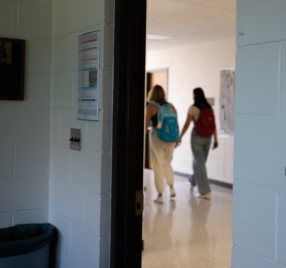 Individuals roaming a hallway in the Communication Arts and Sciences building on MSU’s campus on Wednesday, Sept. 8, 2021. 