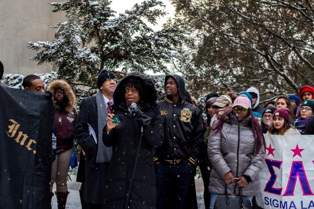 Vice president of Student Affairs and Services, Dr. Maybank reads a speech to the crowd  on Jan. 15, 2018 at Beaumont Tower. Students, professors and Michigan residents marched to Beaumont Tower to commemorate the life and teachings of Dr. Martin Luther King Jr.  