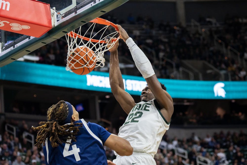 <p>MSU Senior Center Mady Sissoko (22) dunks on Georgia Southern Junior Center David Jones (4) at the Jack Breslin Student Events Center on Nov. 28, 2023. The Spartans would go on to win 86-55.</p>