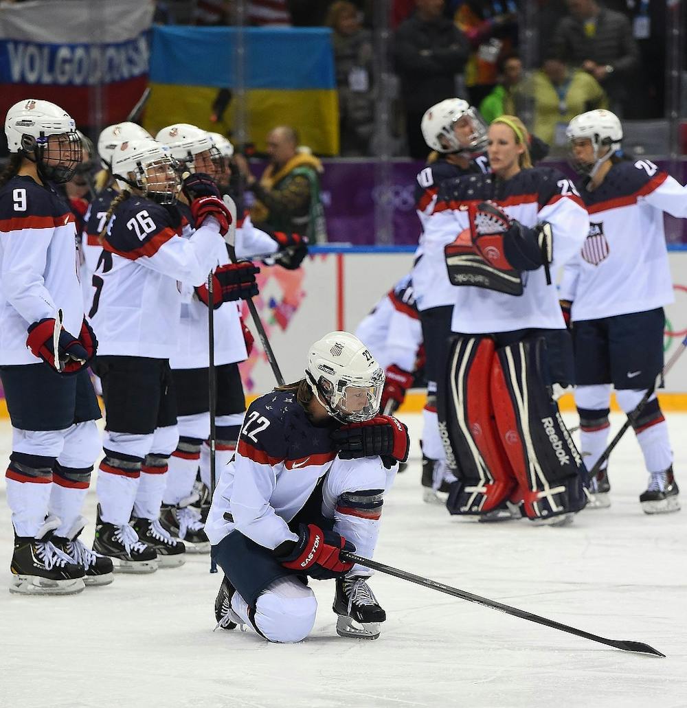 	<p><span class="caps">USA</span> defenseman Kacey Bellamy, 22,  kneels as <span class="caps">USA</span> players watch as Canada players celebrate their victory in overtime of the women&#8217;s Gold Medal hockey game at the Winter Olympics in Sochi, Russia, Thursday, February 20, 2014. Canada defeated <span class="caps">USA</span> 3-2 in overtime to win the Gold Medal. Harry E. Walker/MCT</p>