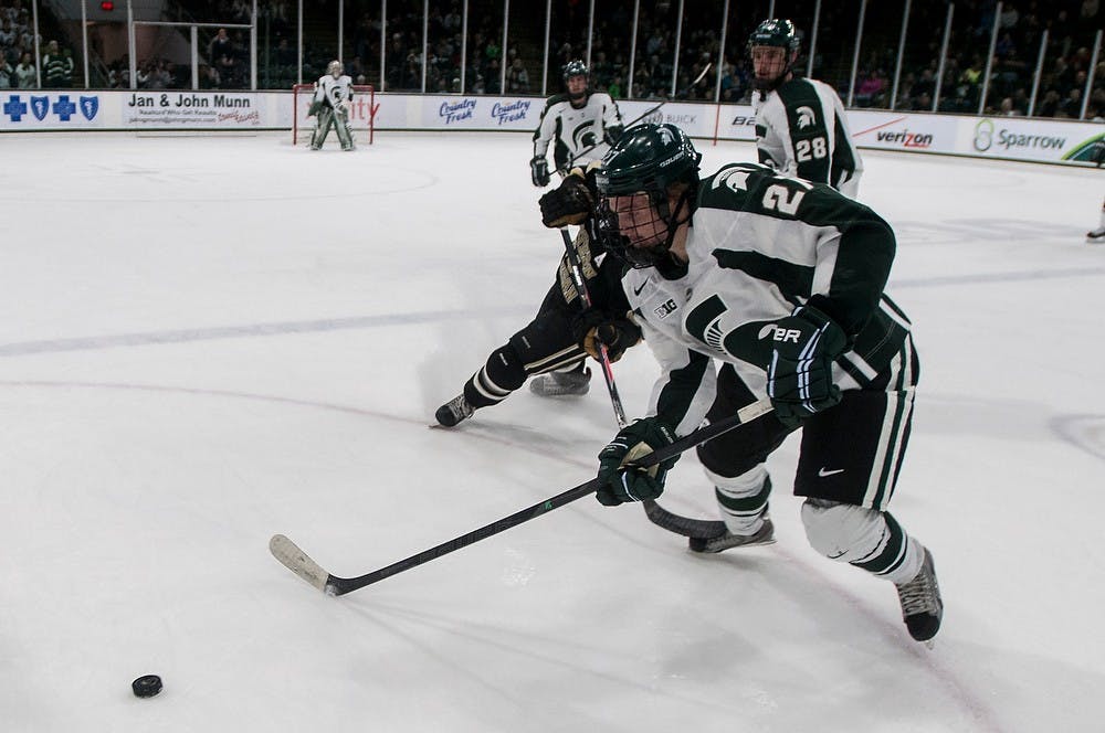 	<p>Junior right wing Matt Berry goes after the puck during the game against Western Michigan on Nov. 22, 2013, at Munn Ice Arena. The Spartans lost to the Broncos, 2-0. Khoa Nguyen/The State News</p>