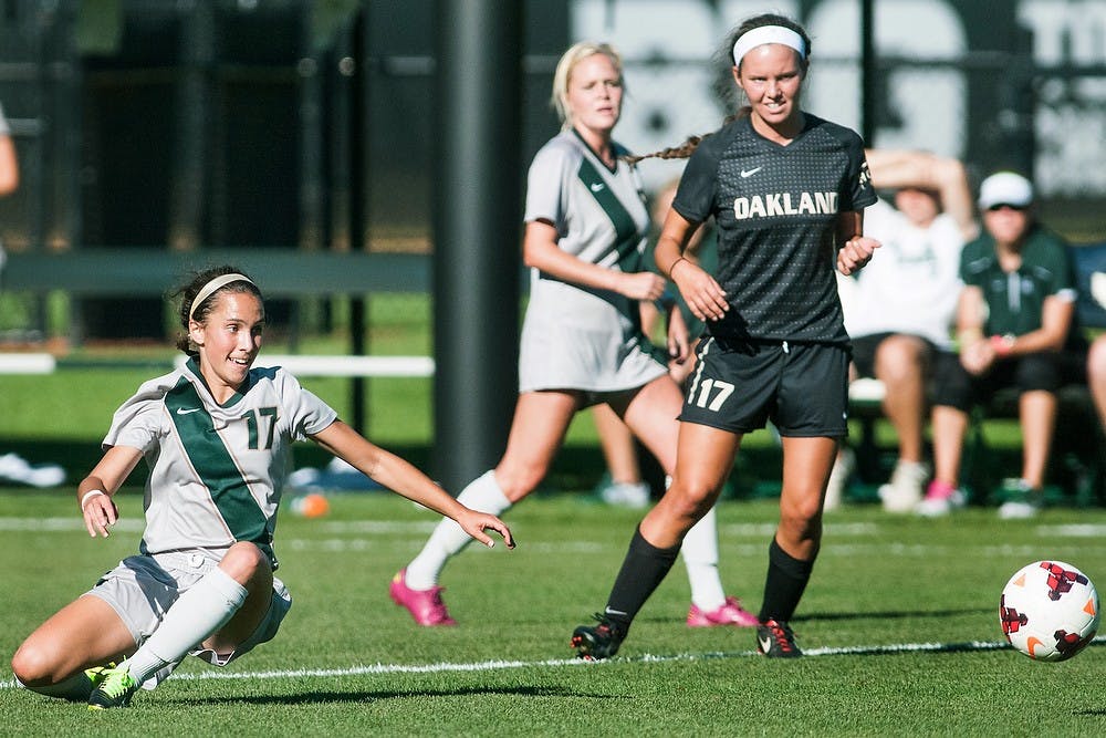 	<p>Sophomore midfielder Sarah Kovan slides after going for the ball during the match Sept. 5, 2013 at DeMartin Stadium. The Spartans tied the Grizzlies, 1-1, after playing two scoreless overtime periods. Khoa Nguyen/The State News</p>