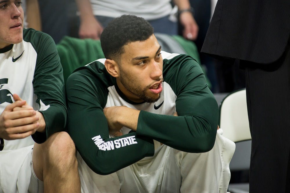 Senior guard Denzel Valentine watches from the bench during the first half of the game against Illinois on Jan. 7, 2016 at Breslin Center. The Spartans defeated the Illini, 79-54. 
