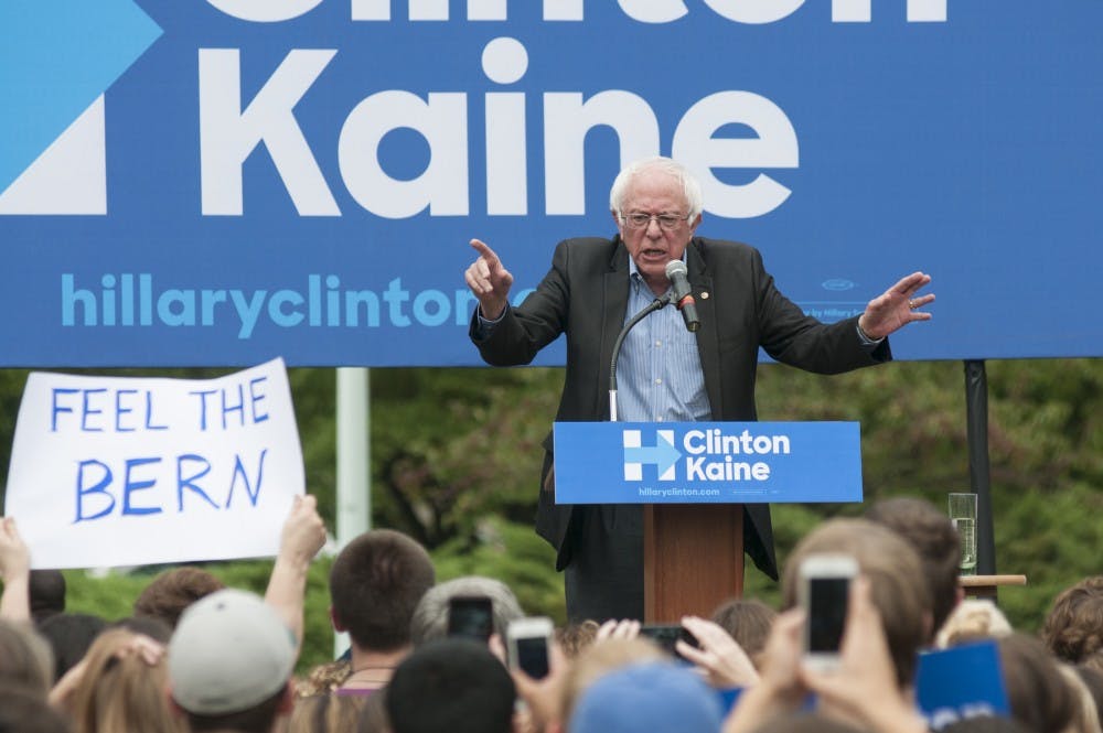 Senator Bernie Sanders speaks into a microphone on Oct. 5, 2016 on Adams Field. Sanders gave a speech in support of Hillary Clinton's presidential campaign. 