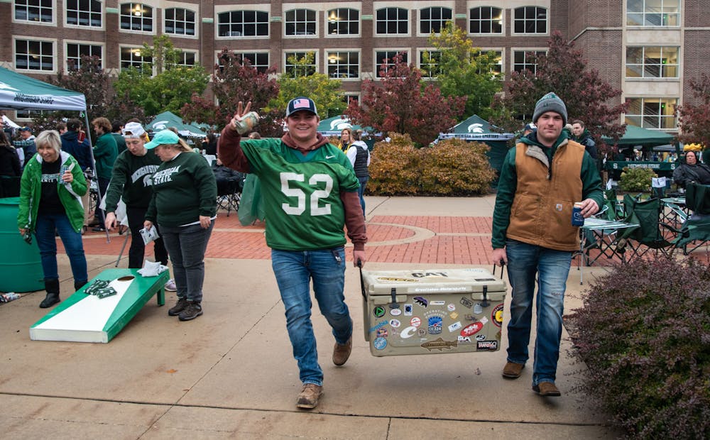 <p>Fans tailgate in preparation for the Michigan State game against Michigan on campus. Shot on Oct. 30, 2021.</p>